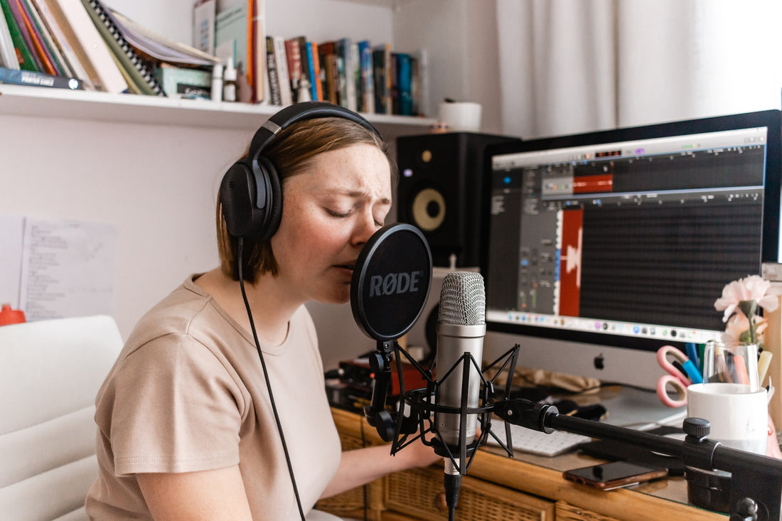 singer recording vocals in studio